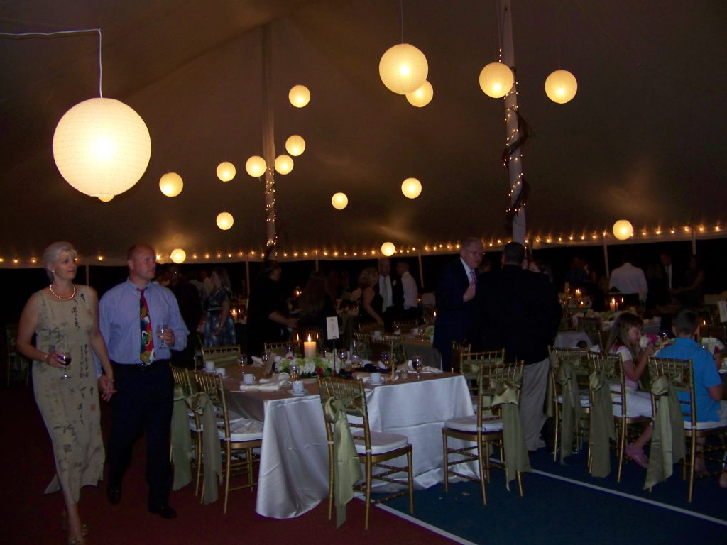 party tent with tables and people under it